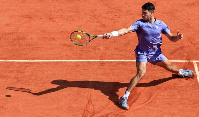 Home-crowd favorite Carlos Alcaraz withdrew from the Madrid Open on Thursday because of muscle injuries, saying he didn't want to risk making things worse before the French Open. (AFP/File)