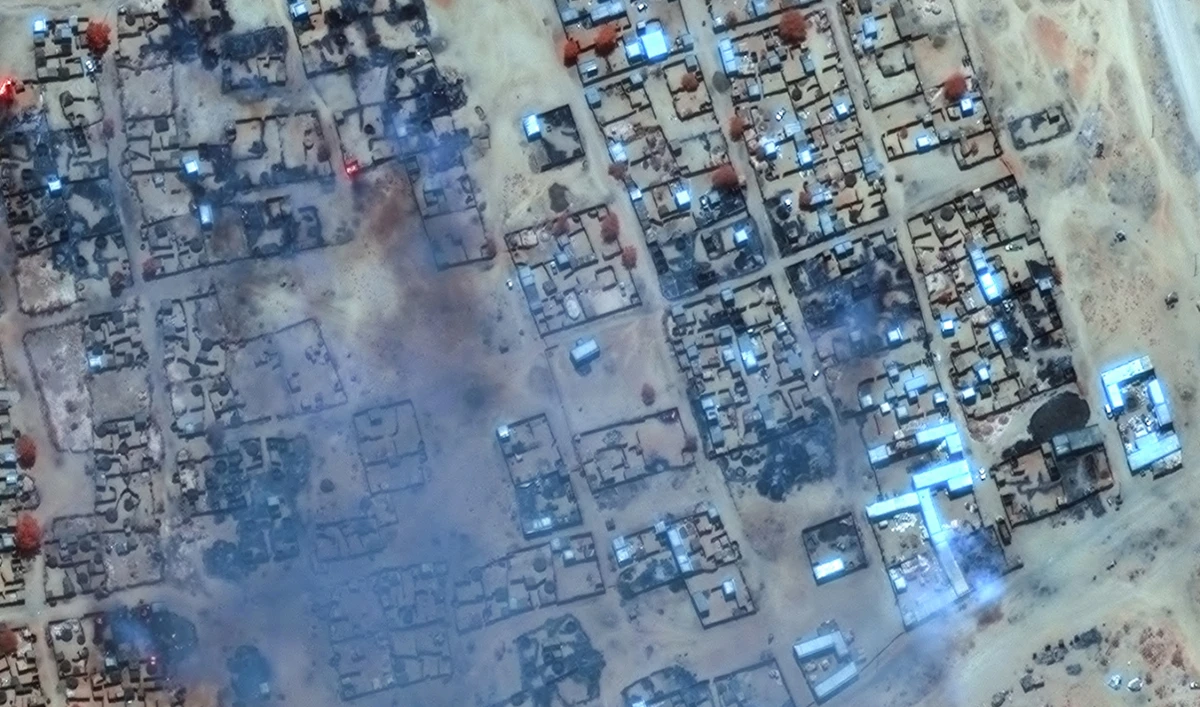 This handout image courtesy of Maxar Technologies released on April 17, 2025, shows smoke billowing and burned buildings in the Zamzam camp near the besieged Darfur city of El-Fasher. (AFP/File)