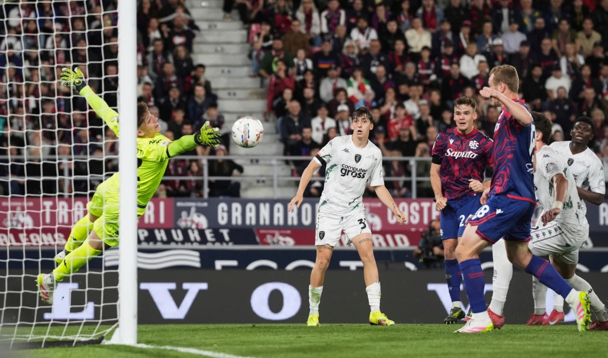 Bologna’s Thijs Dallinga, third from left, scores their second goal of the game past Empoli’s goalkeeper Jacopo Seghetti during an Italian Cup semifinal between Bologna FC and Empoli FC at Renato Dall’Ara Stadium Thursday Bologna, Italy. (AP)