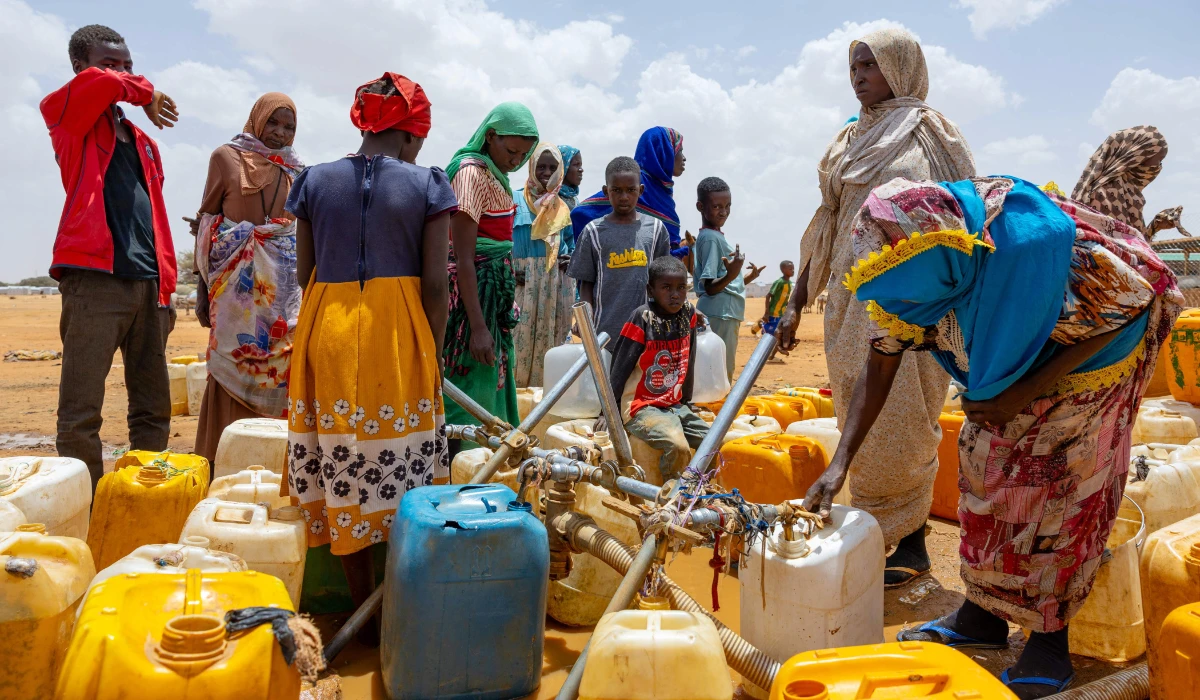 Sudanese refugees fill jerry cans with water at the Touloum refugee camp in the Wadi Fira province, Chad, on April 8, 2025. (AFP)