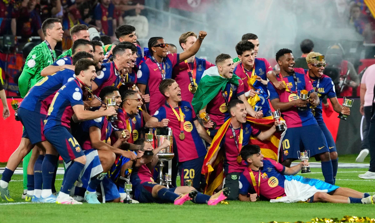 Barcelona players celebrate after winning the Spanish Copa del Rey final soccer match between Barcelona and Real Madrid at Estadio de La Cartuja stadium in Seville, Spain, Saturday. (AP)