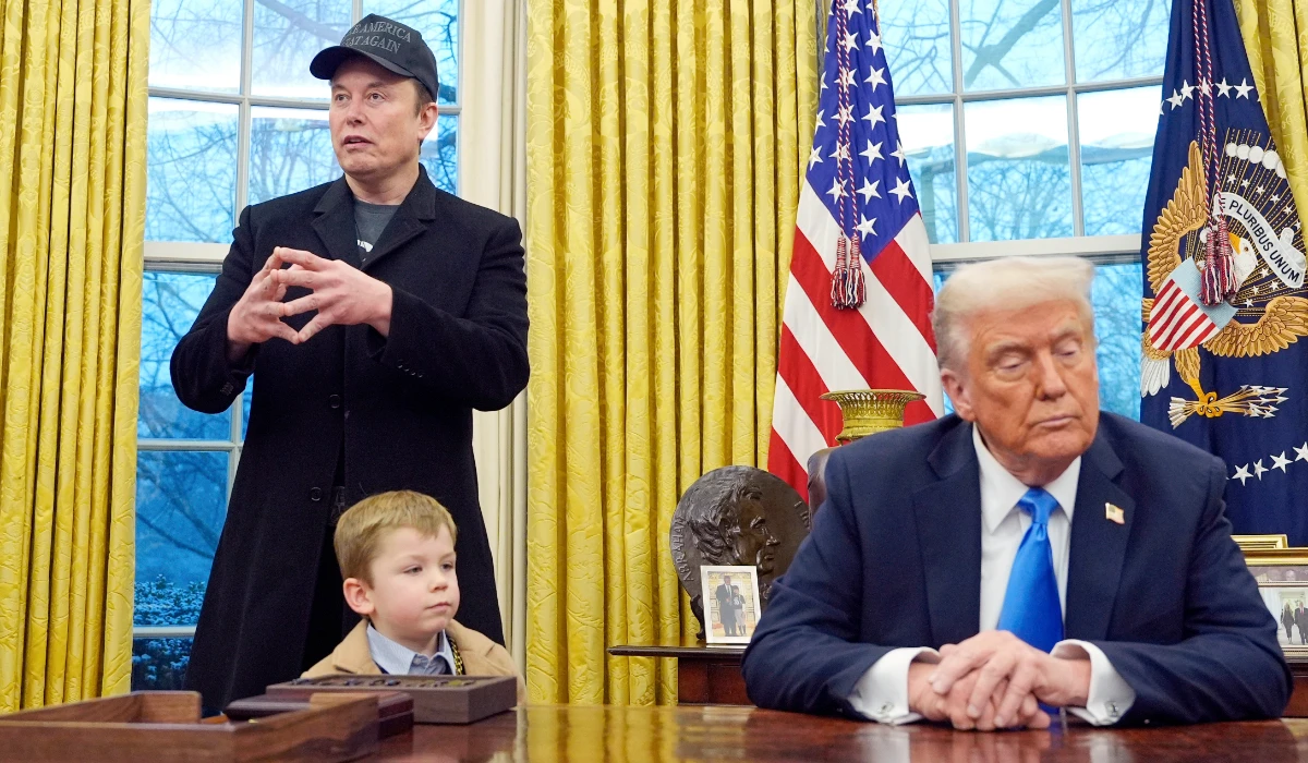 President Donald Trump listens as Elon Musk, joined by his son X Æ A-Xii, speaks in the Oval Office at the White House, Feb. 11, 2025, in Washington. (AP)