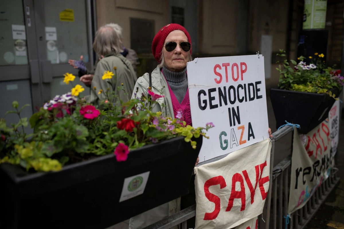 Campaigners calling for an end to the war in Gaza hold their daily demonstration in the town centre of Keighley, northwest England, on June 14, 2024. (AFP)