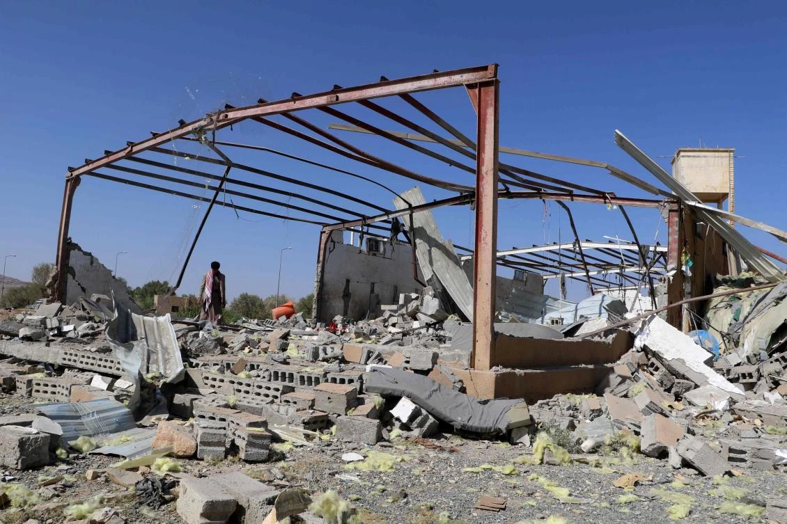 A Yemeni man checks the rubble of a building hit in US strikes in the northern province of Saada on Apr. 29, 2025. (AFP)