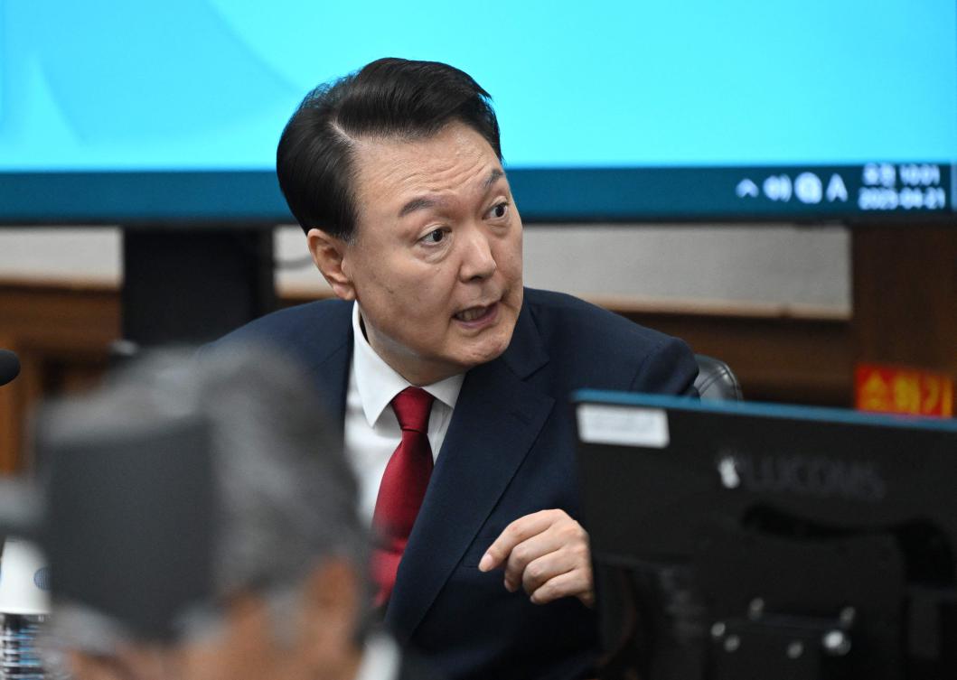South Korea’s former president Yoon Suk Yeol attends his criminal trial on insurrection charges at a courtroom of the Seoul Central District Court in Seoul on April 21, 2025. (AFP)