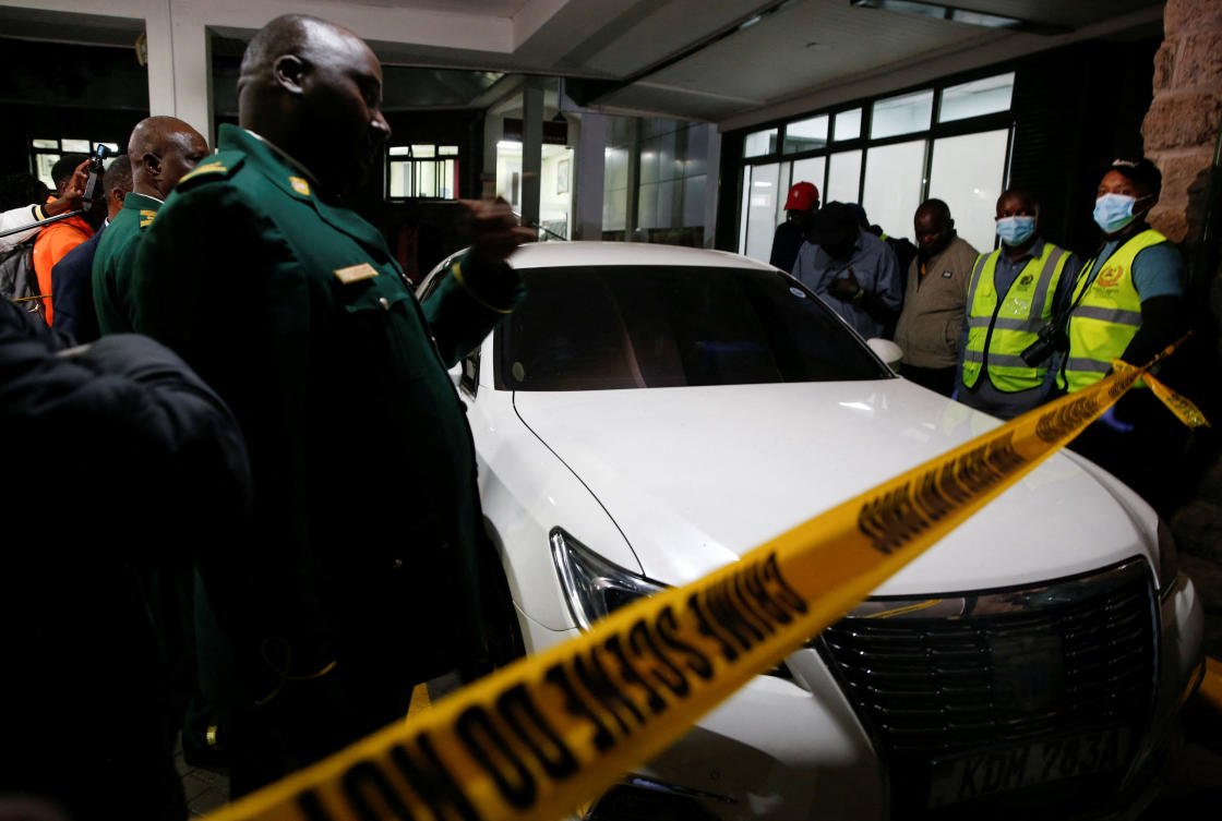 Kenyan Parliamentary staff and forensic experts secure the vehicle in which slain lawmaker Charles Were was shot dead at close range by two gunmen in Nairobi on April 30, 2025. (Reuters)