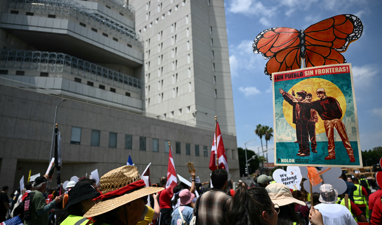 Protestors call for the end of deportations of undocumented immigrants outside the Metropolitan Detention Center of the Federal Bureau of Prisons during a May Day Workers Unite! march in Los Angeles, California, on May 1, 2025. (AFP/File)