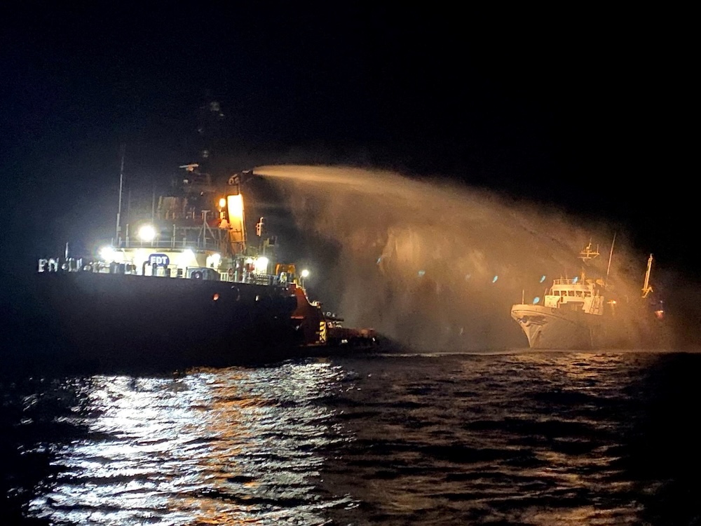 A tug vessel puts out a fire on the Gaza Freedom Flotilla vessel Conscience outside Maltese territorial waters on May 2, 2025. (Government of Malta via Reuters)