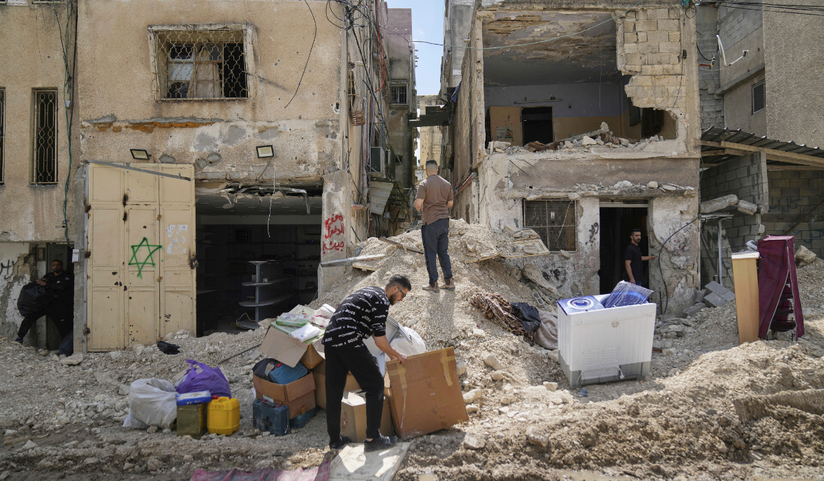 Residents of the now evacuated Palestinian refugee camp of Tulkarem return to collect belongings before the destruction of their homes as Israeli forces prepare to carry out the demolition of 116 homes across the two refugee camps of the Israeli occupied West Bank city of Tulkarem, Friday, May 2, 2025. (AP)