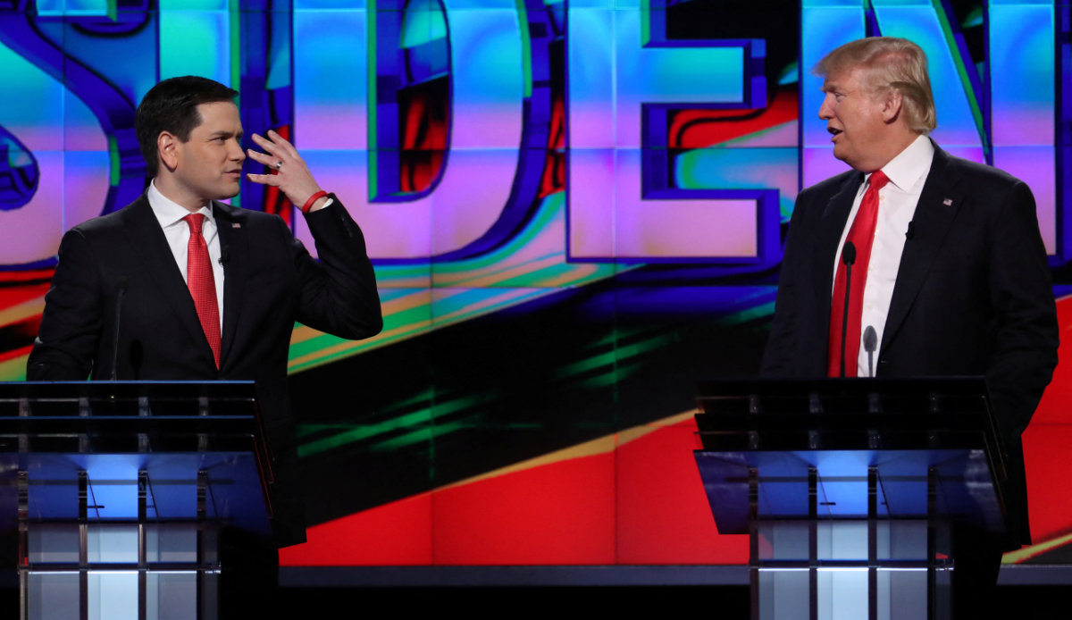 US President Donald Trump gestures as Secretary of State Marco Rubio looks on, during a meeting at the White House in Washington on April 24, 2025. (REUTERS)