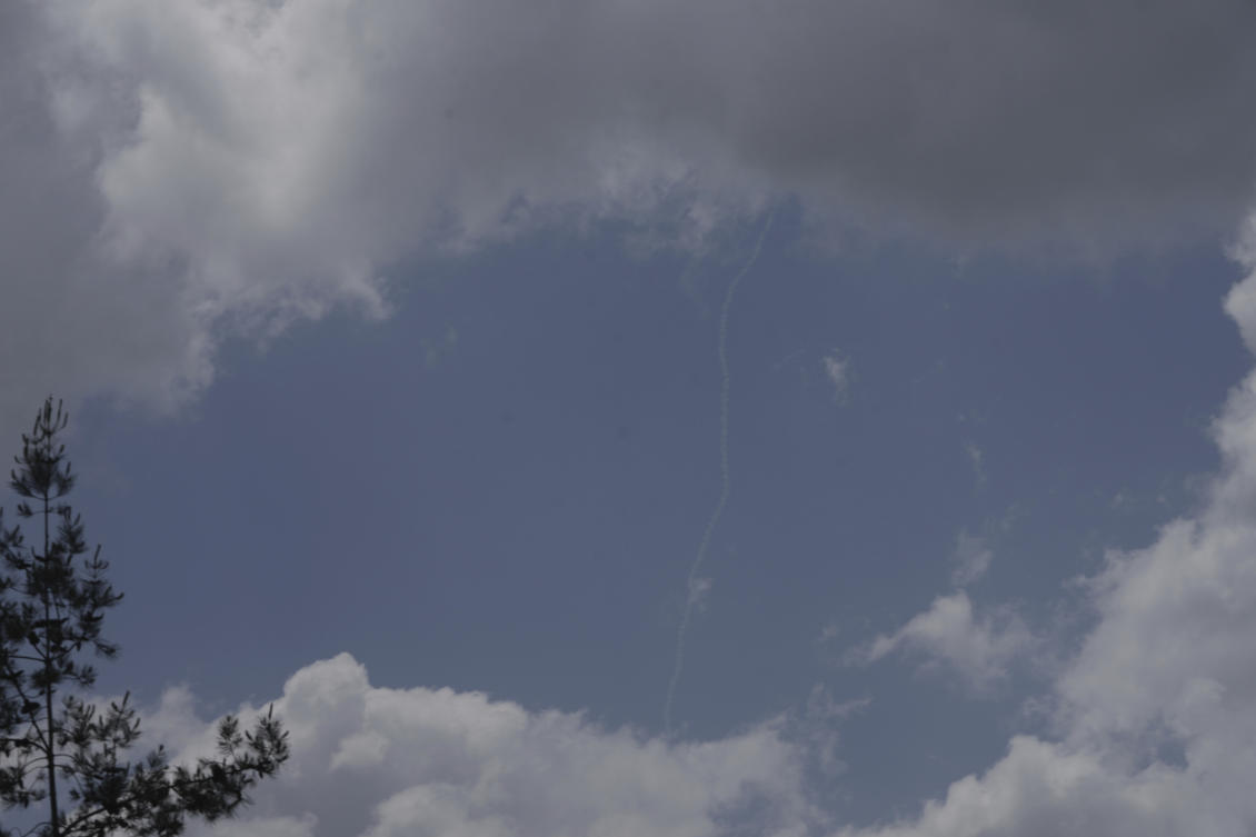 Contrails from the Israeli Iron Dome air defense system fires to intercept projectiles that were launched from Yemen, seen from Highway 1 between Tel Aviv, Israel and Jerusalem, Friday, May 2, 2025. (AP)