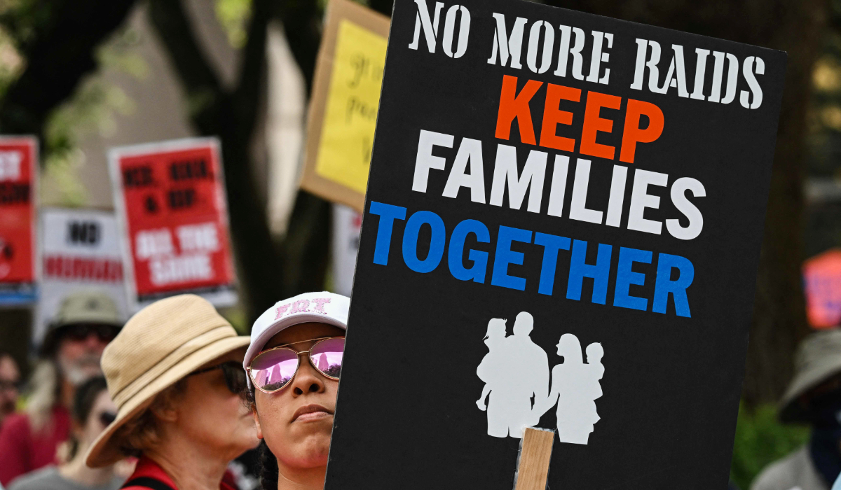 A person holds a during a May Day demonstration against US President Donald Trump and his immigration policies in Houston, Texas, on May 1, 2025. (AFP)