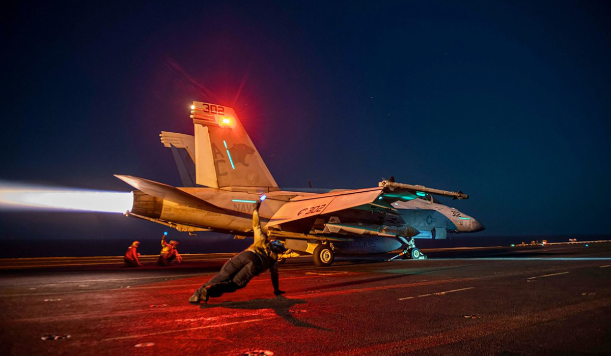 In this on February 24, 2024, image released by the US Central Command, a US fighter plane lauches from the deck of the aircraft carrier USS Eisenhower in the Red Sea during operations against Huthi targets. (AFP)