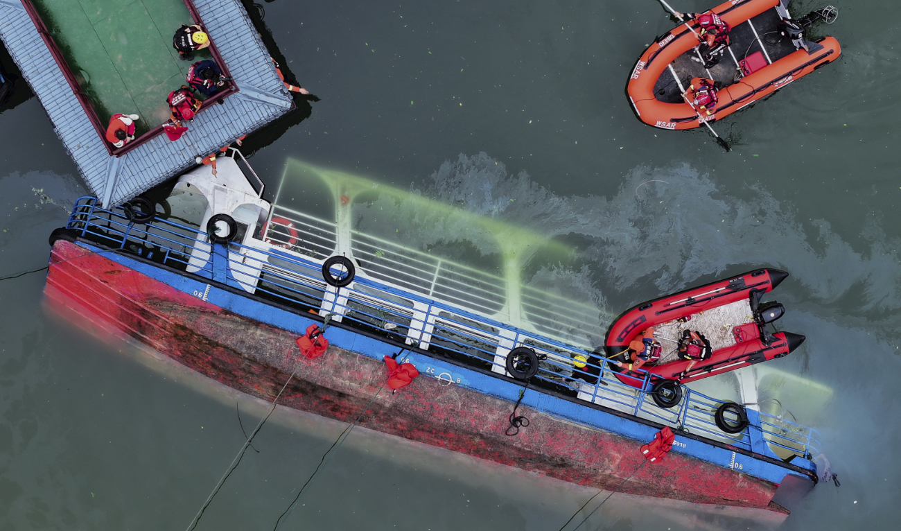 In this photo released by Xinhua News Agency, rescuers conduct a search and rescue operation at one of the two passenger boats capsized in Qianxi City, southwest China's Guizhou Province on Monday, May 5, 2025. (AP)