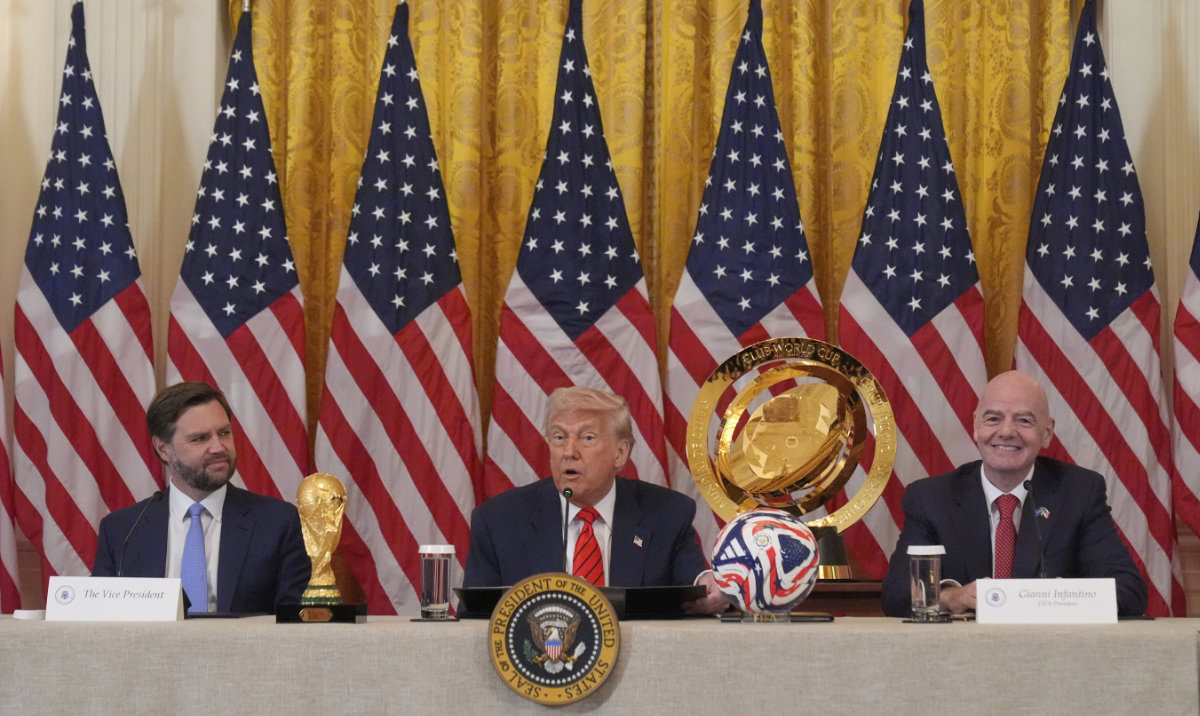 President Donald Trump speaks during a FIFA task force meeting in the East Room of the White House Tuesday in Washington, as Vice President JD Vance and FIFA President Gianni Infantino listen. (AP)