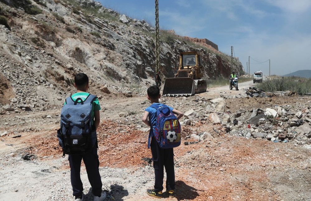 A bulldozer fills a crater following Israeli airstrikes that targeted hilltops near Nabatieh town, south Lebanon, Thursday, May 8, 2025. (AP Photo)
