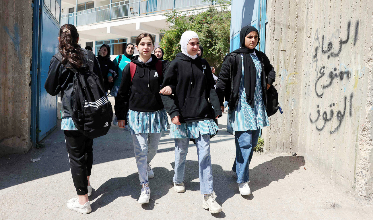 Palestinian children leave a UNWRA school in the Shoafat refugee camp in East Jerusalem on Thursday as Israel reportedly prepares to close the school. (AFP)