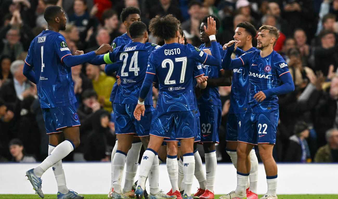 Chelsea's English midfielder #22 Kiernan Dewsbury-Hall (R) celebrates scoring his team's first goal with team mates during the UEFA Conference League semi-final second leg football match between Chelsea FC and Djurgardens IF at Stamford Bridge in London on May 8, 2025. (AFP)