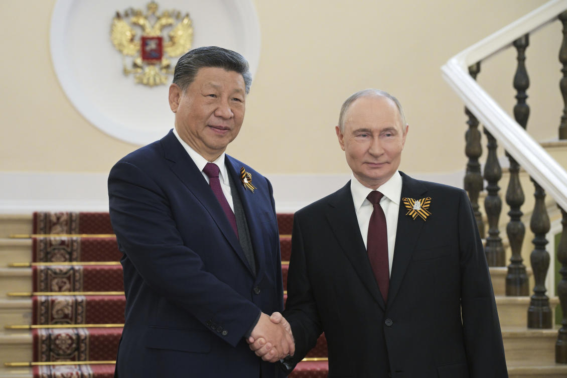 China, Russia vow to strengthen cooperation on international law matters, state media reports. (AP)