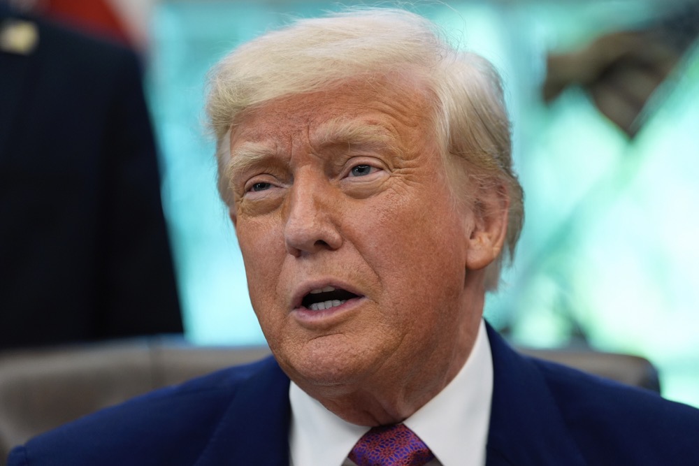 President Donald Trump speaks with reporters as he signs an executive order in the Oval Office of the White House, Friday, May 9, 2025. (AP)