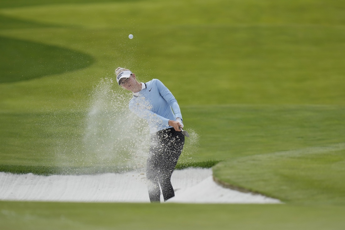 Nelly Korda hits from a bunker toward the seventh fairwaya t the Mizuho Americas Open golf tournament in Jersey City, N.J. (AP)