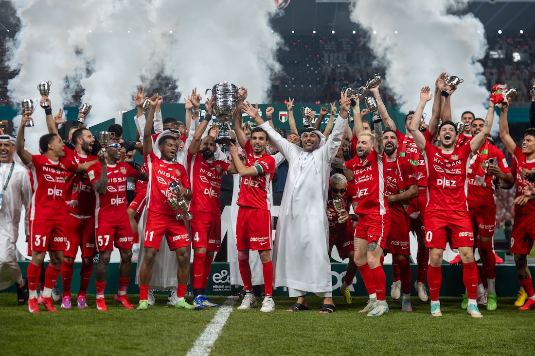 Shabab Al-Ahli players and officals celebrate winning the President's Cup after beating Sharjah 2-1 in Abu Dhabi (X/@Shabab_AlAhliFC)