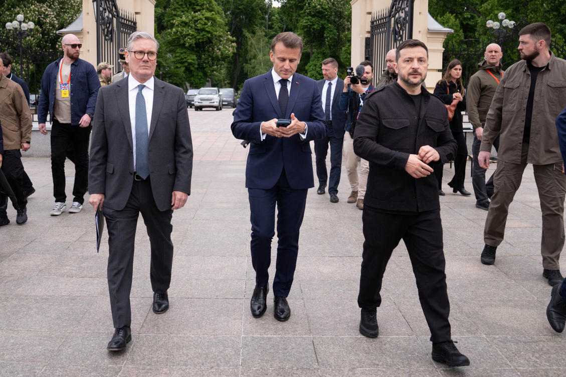 British Prime Minister Sir Keir Starmer, French President Emmanuel Macron and Ukrainian President Volodymyr Zelensky, walk at the Presidential Palace, for a meeting of the so-called "coalition of the willing" in Kyiv, May 10, 2025. (Reuters)