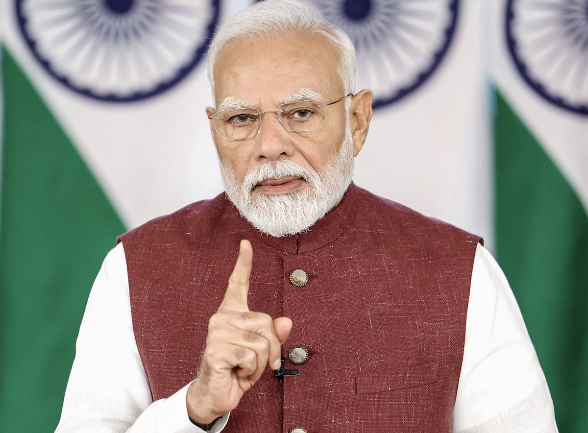India’s Prime Minister Narendra Modi addresses the nation following a truce with Pakistan, via video conferencing in New Delhi. (Reuters)