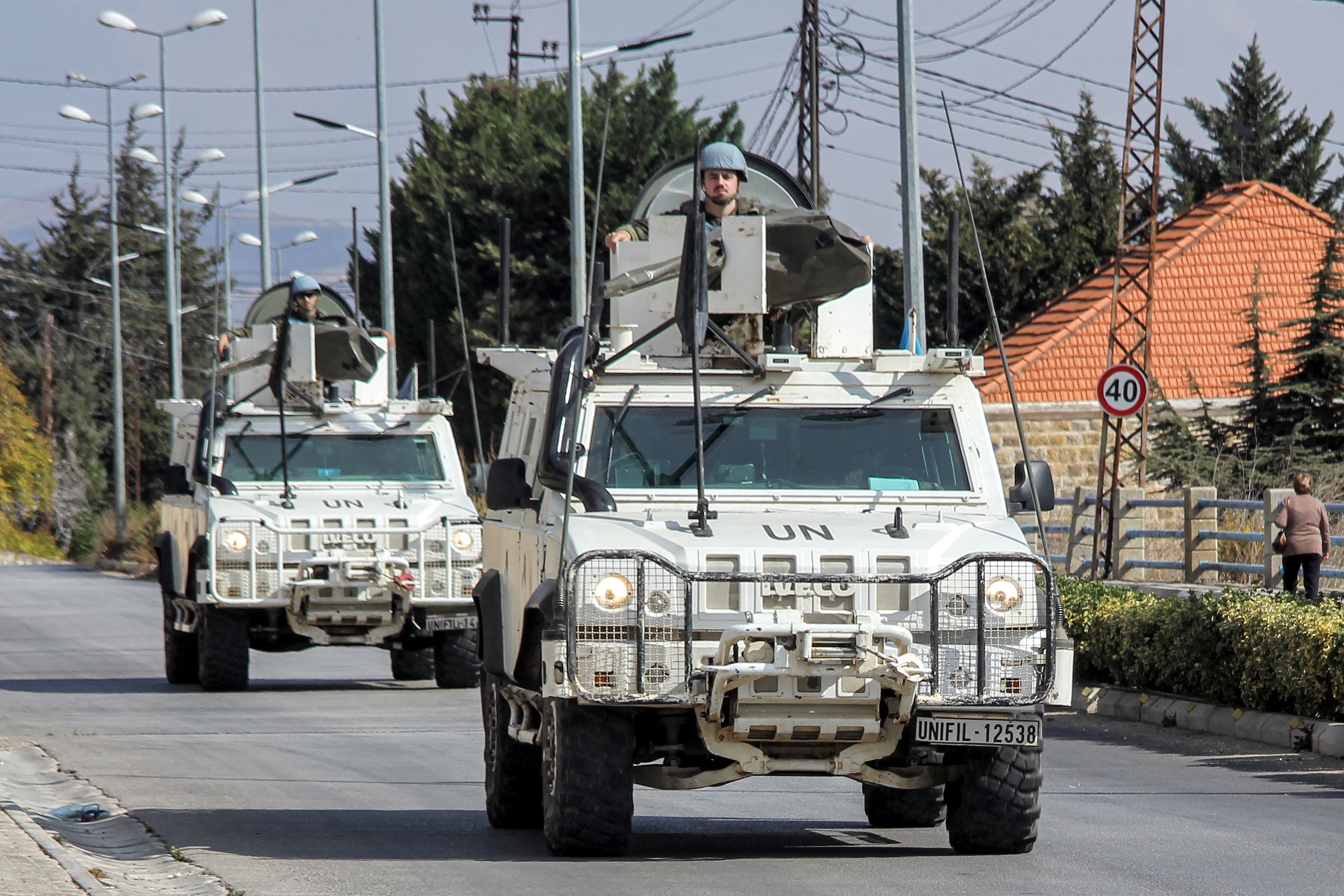 UN peacekeepers ride in vehicles of the UN Interim Force in Lebanon (UNIFIL) while patrolling along a road in Lebanon's southern village of Kfar Kila close to the border with Israel, Mar. 17, 2025. (AFP)