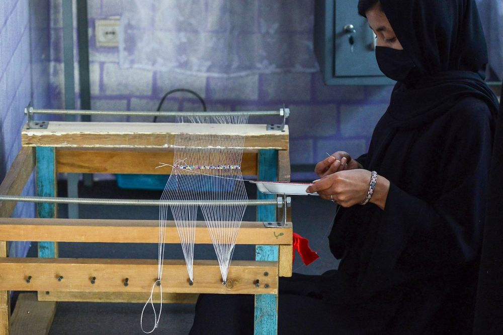 An Afghan woman manufactures beads jewelry at a workshop in Kabul, Nov. 10, 2024. (AFP)