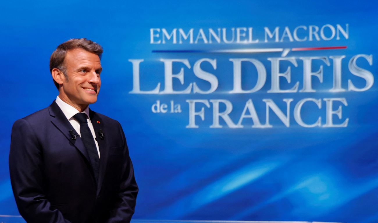 France's President Emmanuel Macron poses for photograph on the set prior to his guest appearance on a special program of the French channel TF1 in Saint-Denis, north of Paris, on May 13, 2025. (AFP)