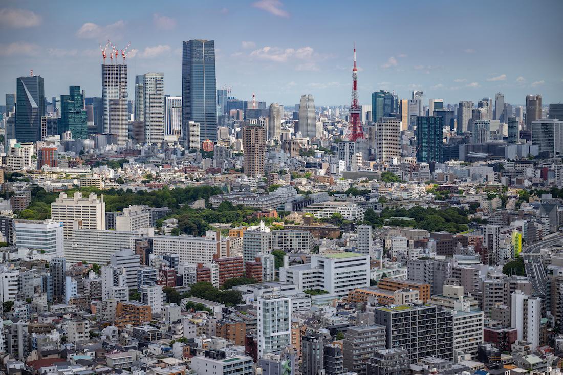 The city skyline is seen as the Tokyo Tower looms in the background in Tokyo. (File/AFP)