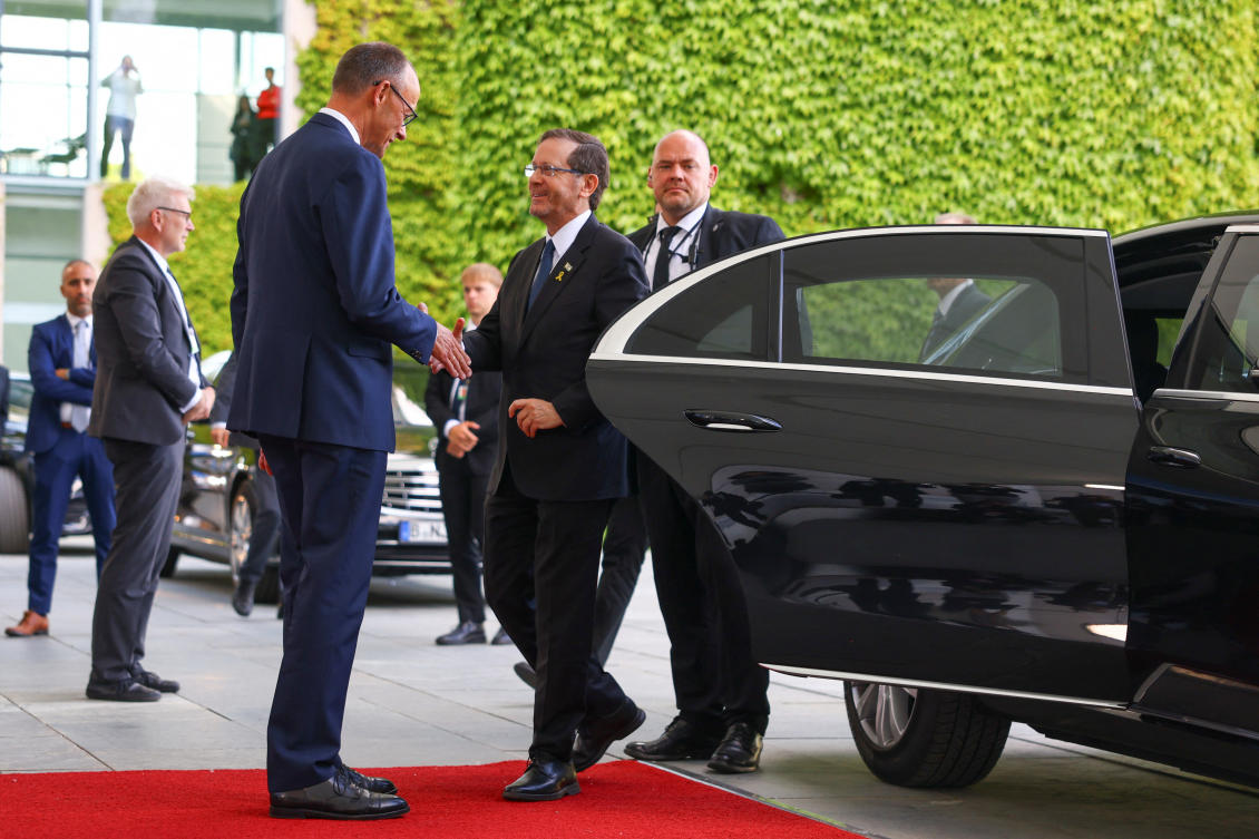 German Chancellor Friedrich Merz receives Israel’s President Isaac Herzog for talks at the Chancellery in Berlin, May 12, 2025. (Reuters)