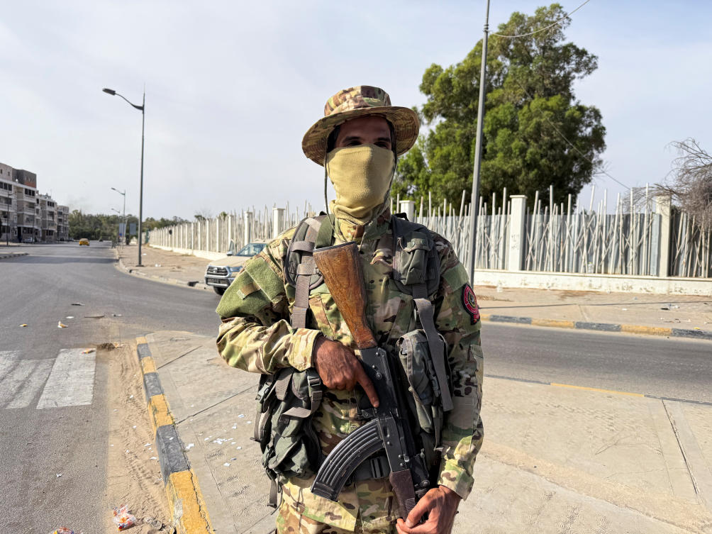 A member of the 444 Brigade of the Libyan Army, a unit serving the Government of National Unity and PM Abdulhamid Al-Dbeibah, stands guard at Abu Salim area, in Tripoli, May 13, 2025. (Reuters)
