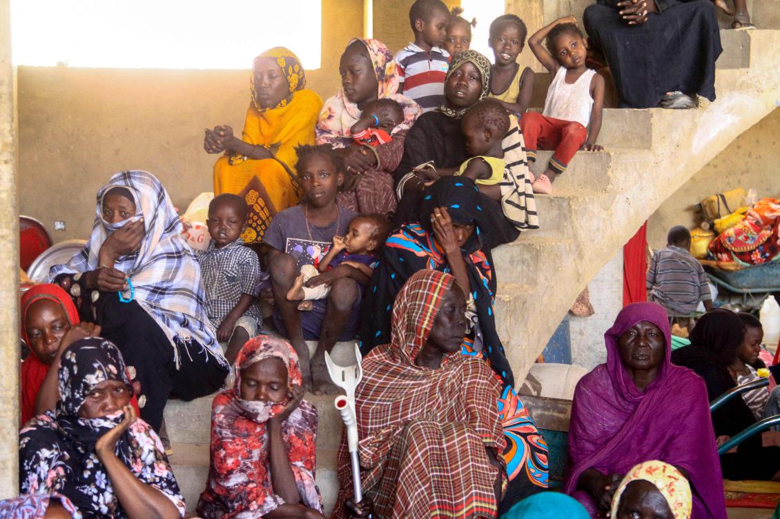 Displaced Sudanese sit at a shelter after they were evacuated by the Sudanese army to a safer area in Omdurman, on May 13, 2025. (AFP/File)