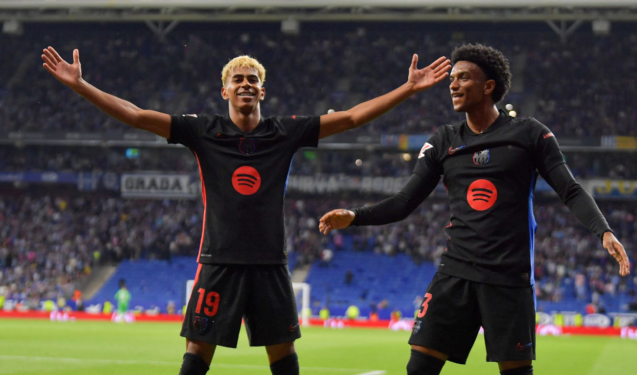 Barcelona's Spanish forward #19 Lamine Yamal celebrates scoring his team's first goal next to teammate #03 Alex Balde (R) during the Spanish league football match between RCD Espanyol and FC Barcelona at the RCDE Stadium in Cornella de Llobregat, on May 15, 2025. (AFP)