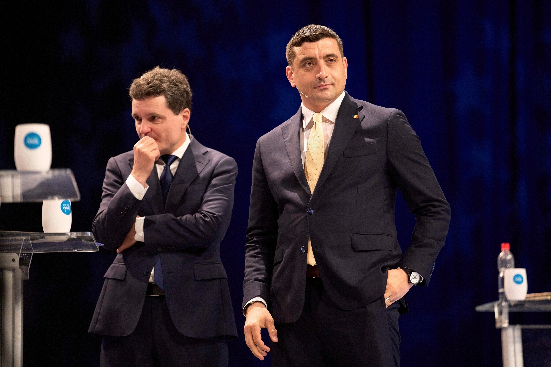 Presidential candidates Nucisor Dan and George Simion at a live electoral debate in Bucharest, Romania. (AP)