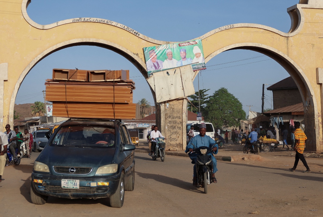 Commuters outside an access gate into Bauchi State, Nigeria. (Reuters)