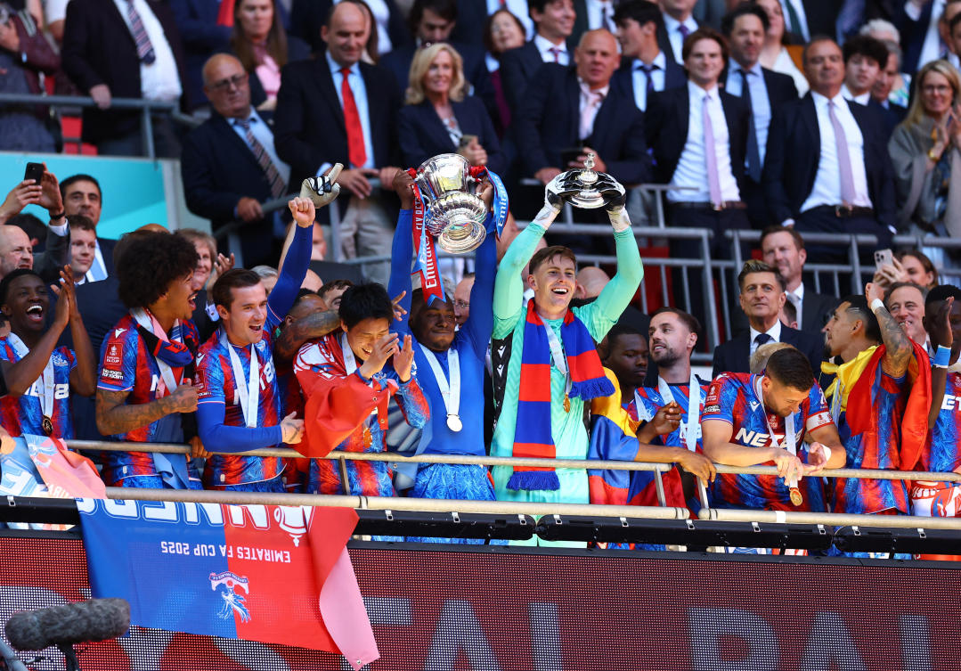 Crystal Palace’s Eberechi Eze with teammates celebrate with the trophy after winning the FA Cup. (Action Images via Reuters)