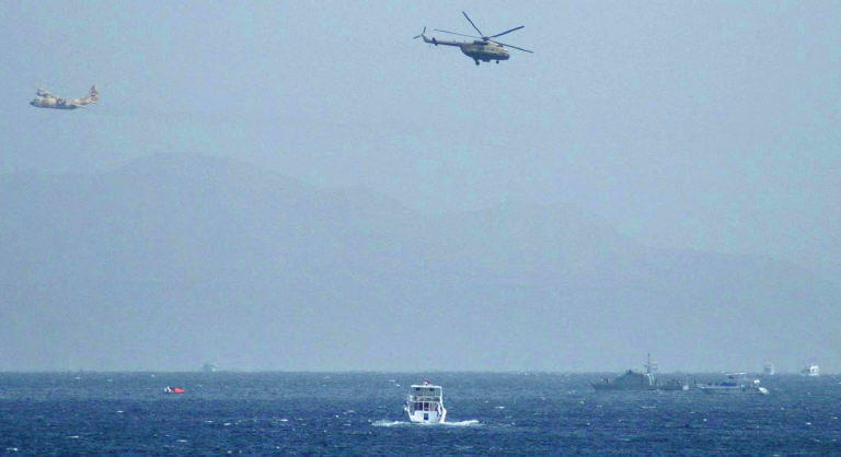 An Egyptian Hercules military aircraft (L) and a helicopter can be seen circling three miles off Sharm El Sheikh. (File/AFP)