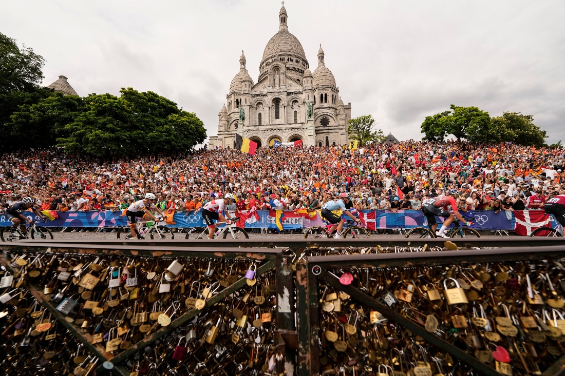 Cyclists ride past the Sacre Coeur basilica during the men's road cycling event, at the 2024 Summer Olympics, France. (AP)