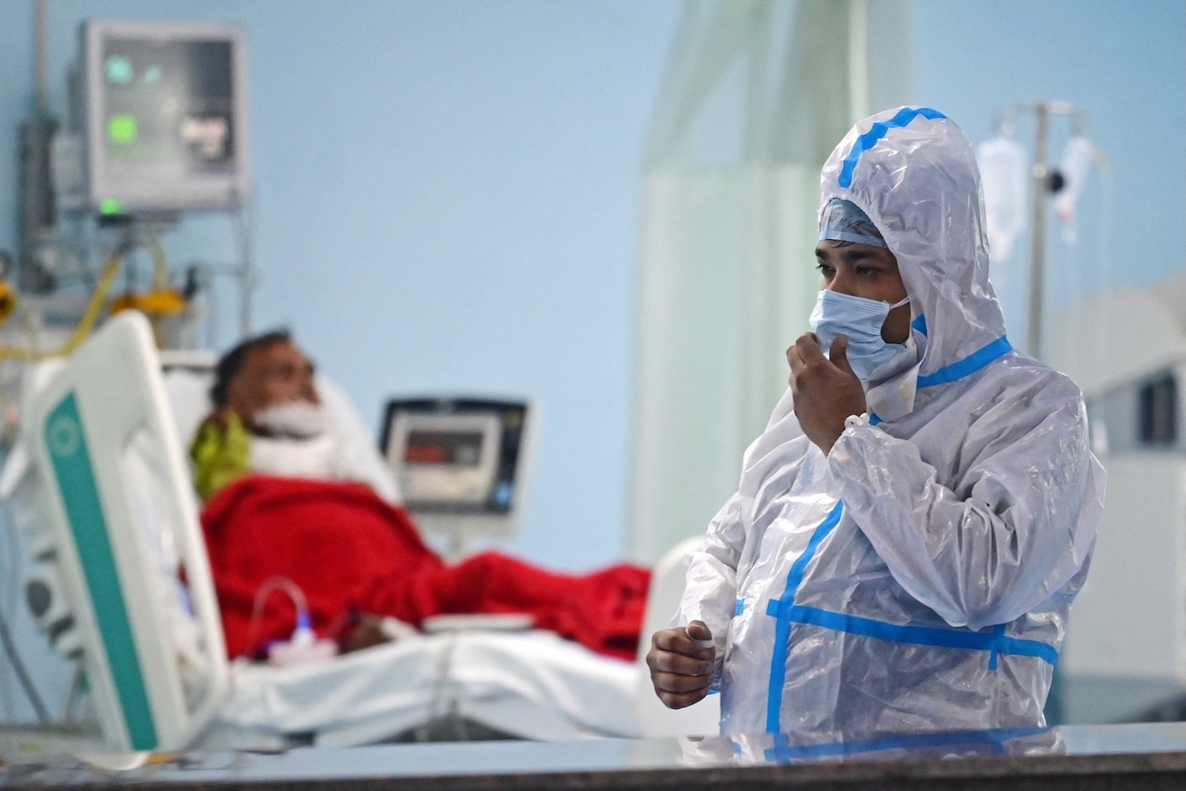 Health workers take part in a mock drill to check preparations for the COVID-19 facilities at a hospital in Prayagraj on April 11, 2023. (AFP)