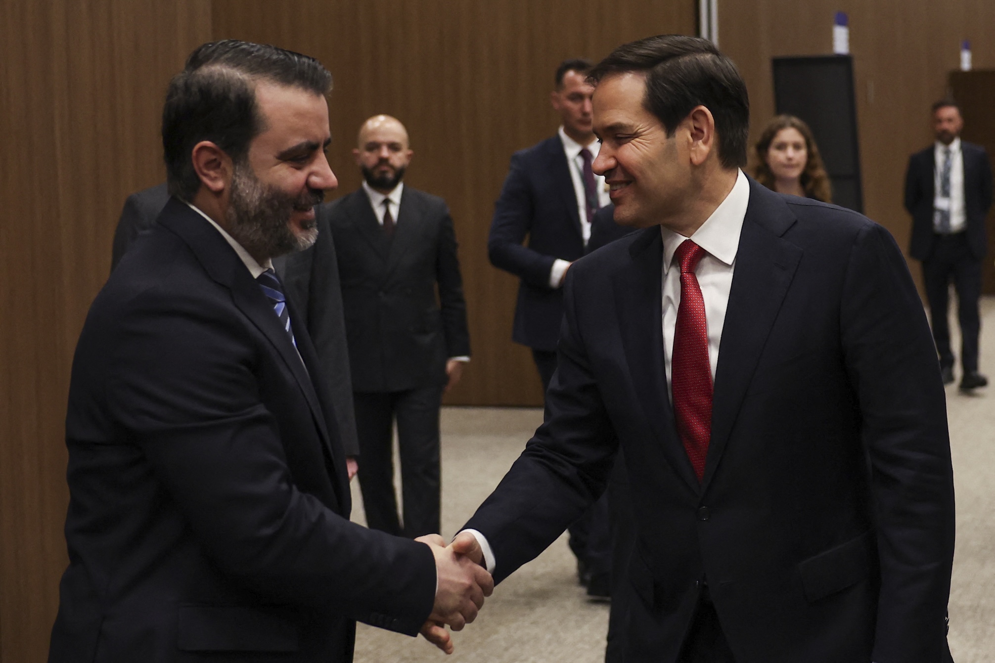 Syrian Foreign Minister Asaad Hassan al-Shibani (L) shakes hands with U.S. Secretary of State Marco Rubio at the NEST International Convention Center, in Antalya, May 15, 2025. (AFP)