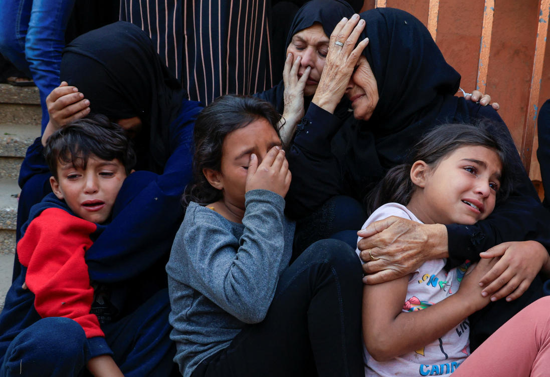 Mourners attend the the funeral of Palestinians killed in Israeli strikes, at Nasser hospital, in Khan Younis, southern Gaza Strip Wednesday. (Reuters)