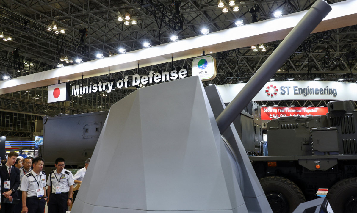 Japan flexes defense ambitions at arms show