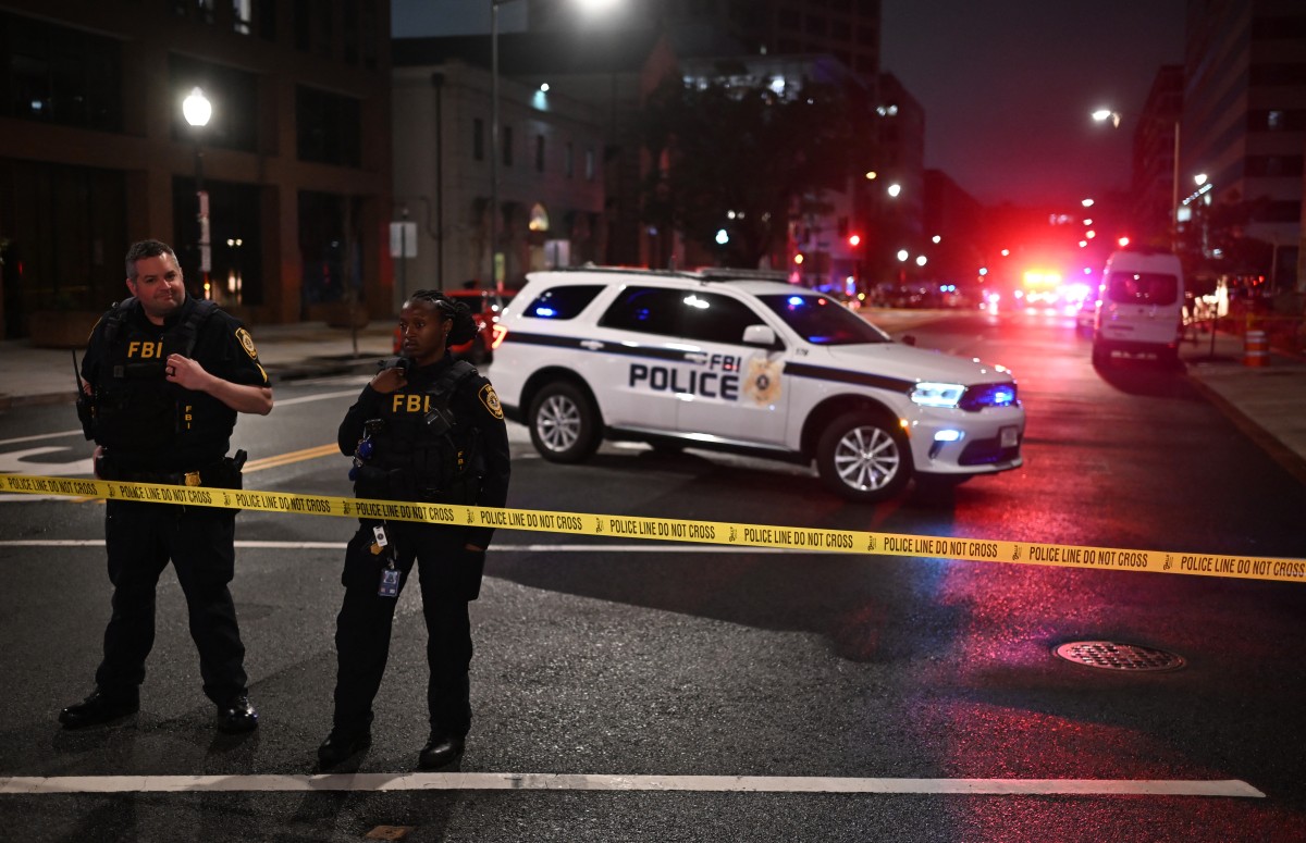 FBI agents cordon off the scene outside the Capital Jewish Museum following a shooting that left two people dead, in Washington, DC, in the early hours of May 22, 2025. (AFP)