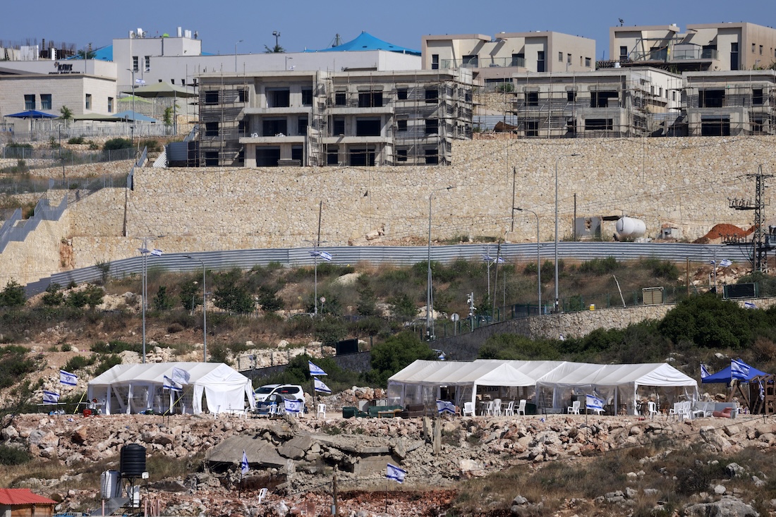 Tents are set up by Israeli settlers in the Palestinian village of Bruqin, outside the walls of an illegal settlement of the same name. (File/AFP)