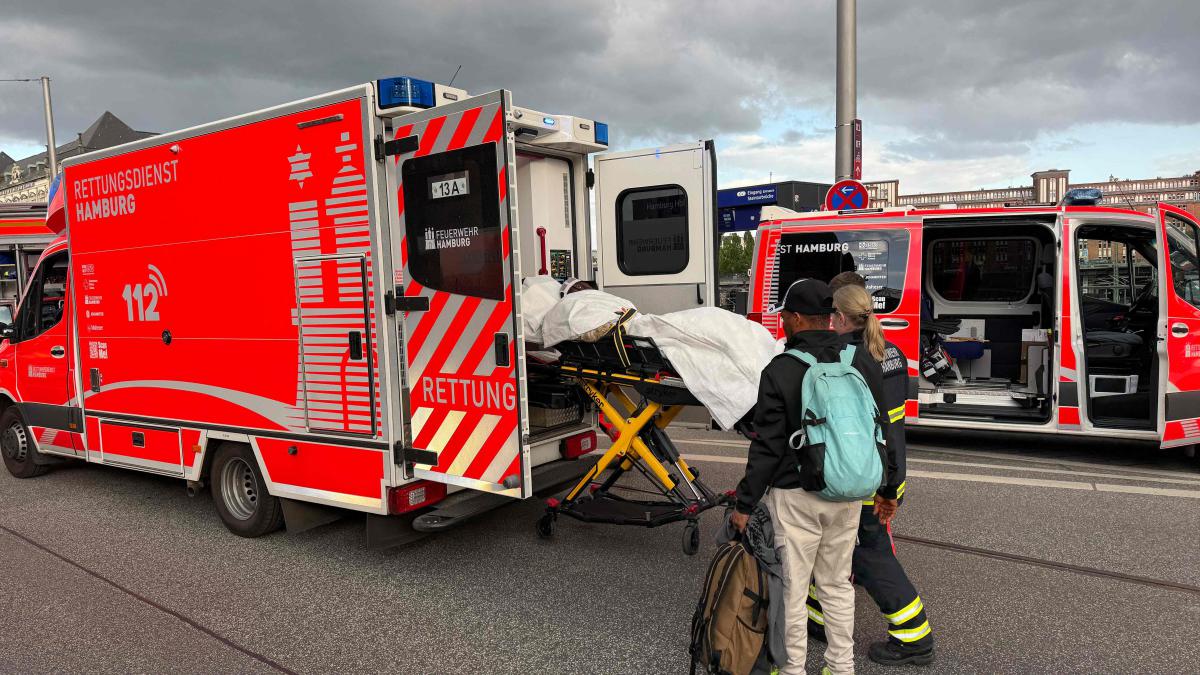 Members of the emergency services work at the scene at Hamburg's main train station where several people were stabbed Friday. (AFP)