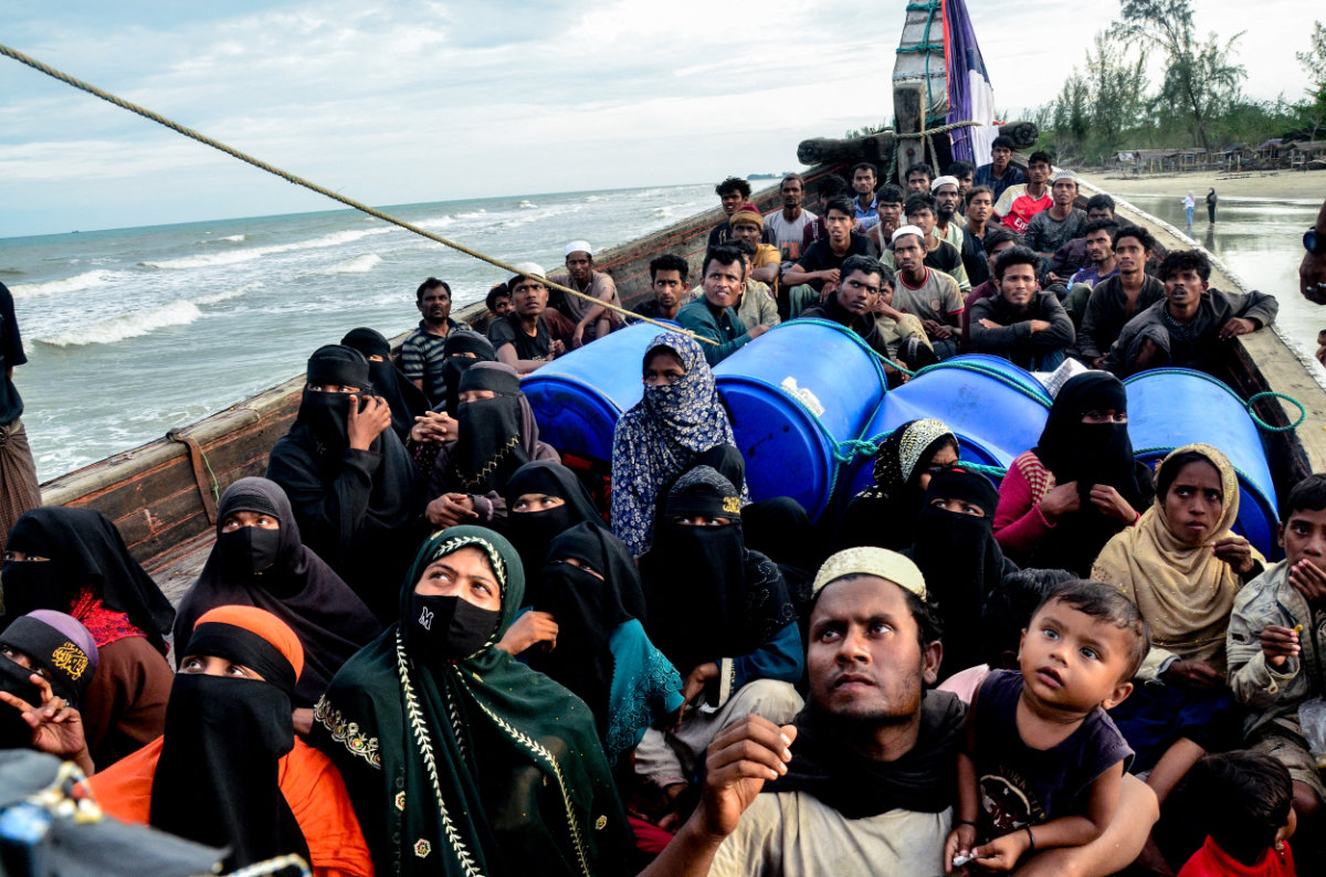 In this photo taken on January 29, 2025, Rohingya refugees remain aboard their boat at Leuge Beach in Indonesia's Aceh province after authorities prevented them from disembarking. (AFP)