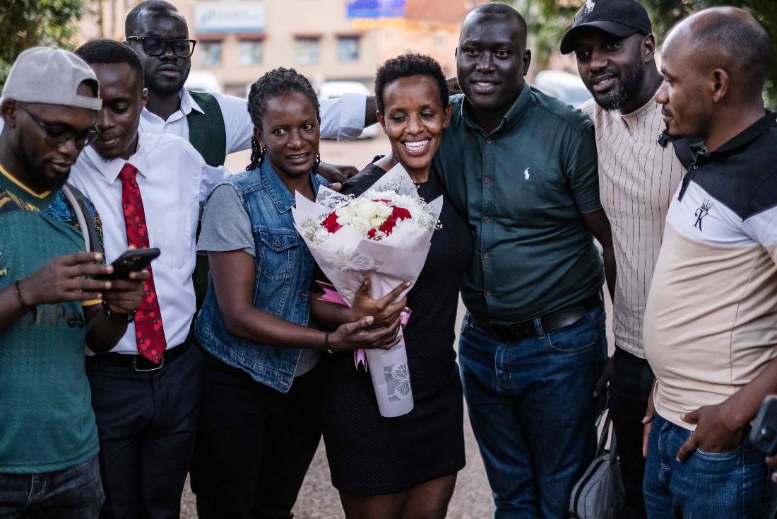 Ugandan activist, lawyer, and journalist Agatha Atuhaire welcomed by colleagues after her release from detention by Tanzanian authorities in Kampala, Uganda. (AFP)